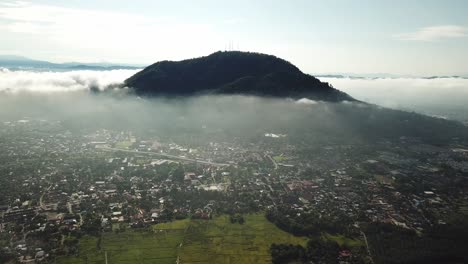 Aerial-panning-Berapit-Town-over-the-thin-fog-at-Malaysia,-Southeast-Asia.